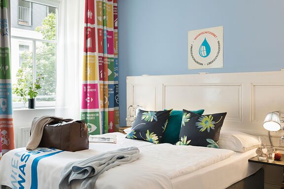 Ökonomy Zimmer im SDG 6 Stil