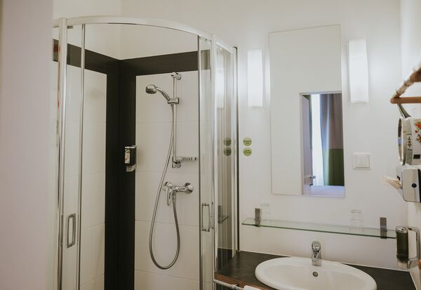 Bathroom with shower at our Main Building