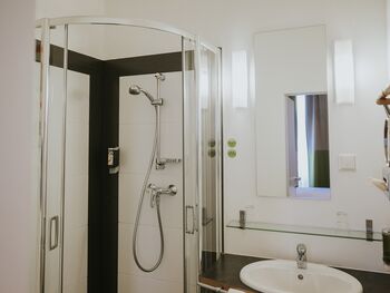 Bathroom with shower at our Main Building