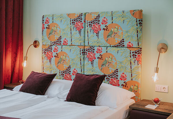 Bett im Familienzimmer des Boutiquehotel Stadthalle